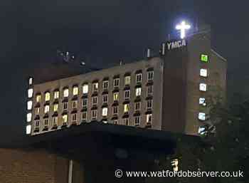 Illuminated cross reinstalled on roof of YMCA in Watford