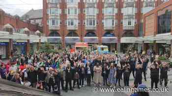 Ealing flash mob perform Queen anthem in a novel way