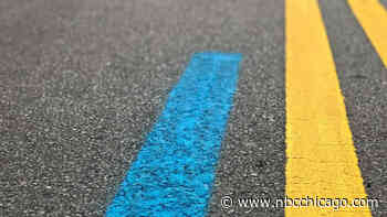Here's what the blue line painted on city streets means for Chicago Marathon runners