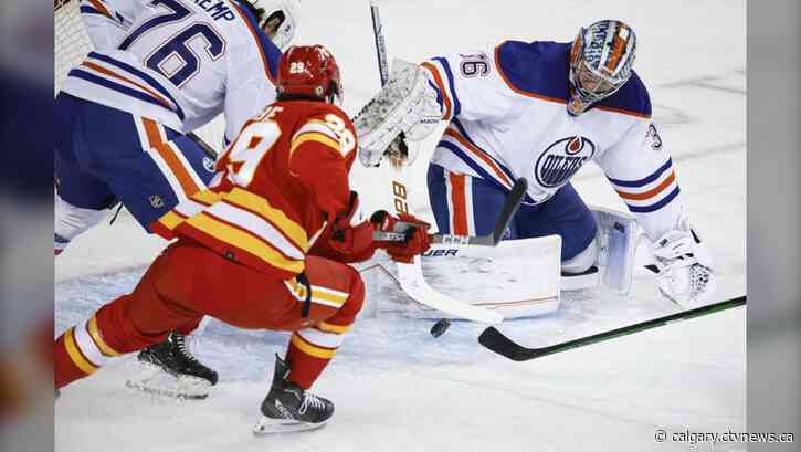 Malone scores in OT as Oilers rally to beat Flames 2-1