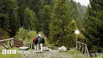 Migrants trying to reach the UK cross the Alps on foot