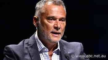 Man accused of abusing Stan Grant online has three charges dropped, offers to apologise