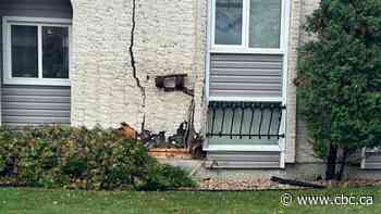 Driver, 63, dies after car crashes into houses in Winnipeg