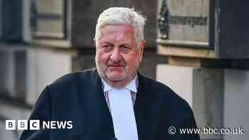 Salmond lawyer suspended over train video comments