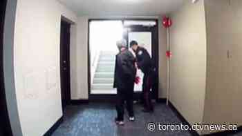 Video shows man being led away in handcuffs following double stabbing in Toronto