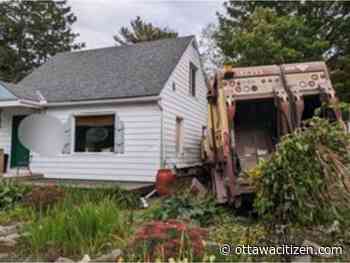 Minor injuries to driver as garbage truck crashes into central Ottawa home