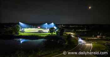 Suburban Skyview: A quietly busy moment on a humid night in Bartlett