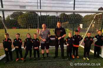 Hughes Electrical supplies football team with custom-made tracksuits