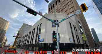 Concrete panel falls from downtown Edmonton building, spurs sidewalk and bike lane closures