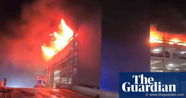 Flames engulf London's Luton airport multistorey car park – video report