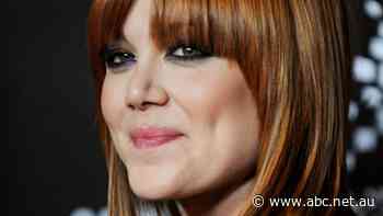 Vanessa Amorosi breaks down in court and says a property dispute with her mother started a family 'war'