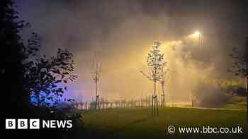 Man arrested after new homes destroyed by fire