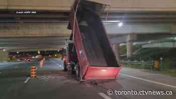 Truck with raised bed hits overpass, closes lanes on GTA highway