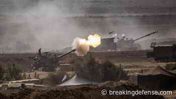 On Israel’s front line, a grim silence and a military build-up