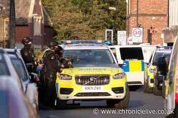 Armed police swarm Wallsend street as officers block road