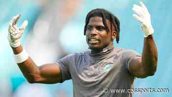 LOOK: Dolphins WR Tyreek Hill grabs someone's phone in end zone, records backflip TD celebration vs. Panthers