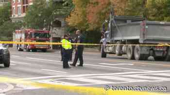 Woman dies after being struck by dump truck in midtown Toronto