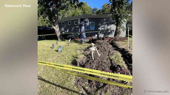 Austin family waiting for City inspection turns trench into Halloween display