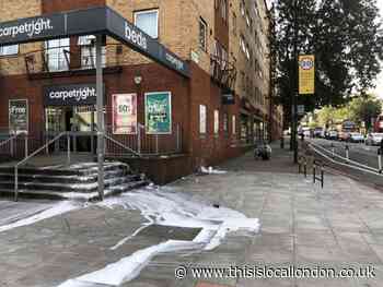 Vandals cover Carpetright on Holloway Road in paint