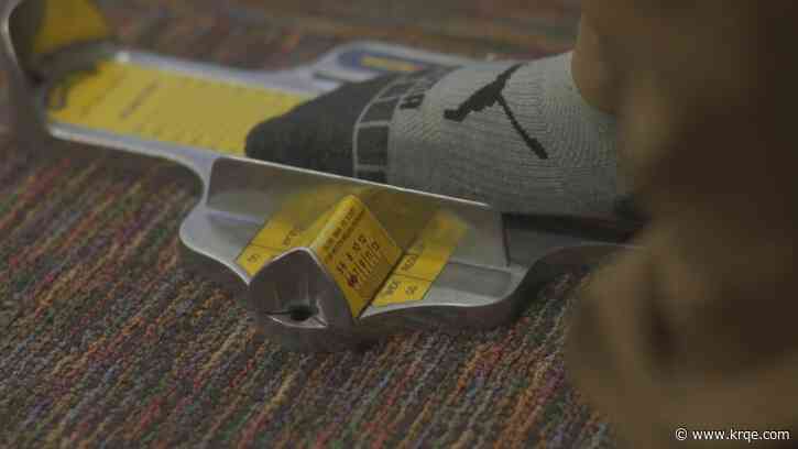 The steps leading up to putting shoes on kids for KRQE Cares Shoes for Kids