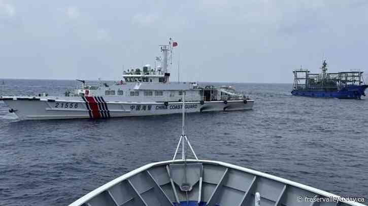 Philippines says a coast guard ship and supply boat are hit by Chinese vessels near disputed shoal