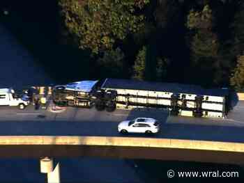 Both lanes closed on I-85 ramp as crews work to clear overturned tractor-trailer in Durham County