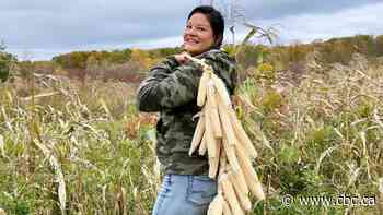 Honing my skills on husks at the Six Nations community corn harvest