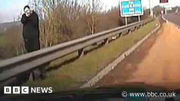 Motorway man jailed for aiming 'weapon' at police