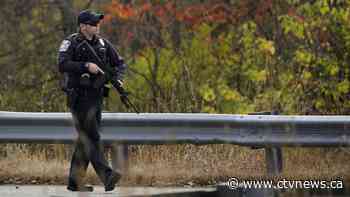 Heavily armed police surround home in search for suspect in the fatal shooting of 18 in Maine