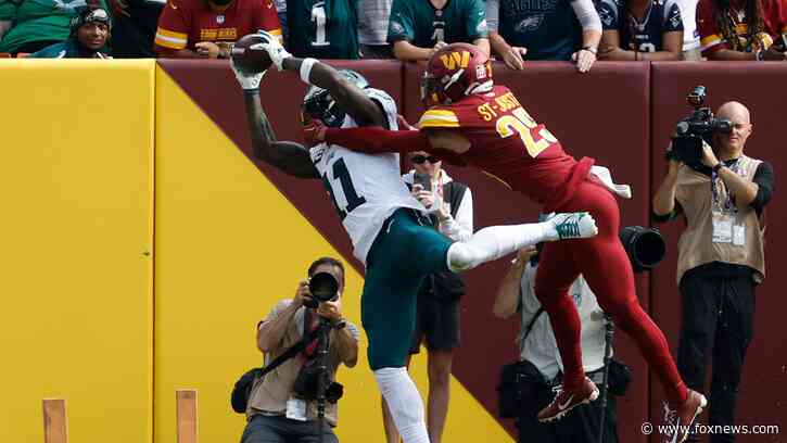 AJ Brown sets NFL record as Eagles use second-half surge to beat Commanders
