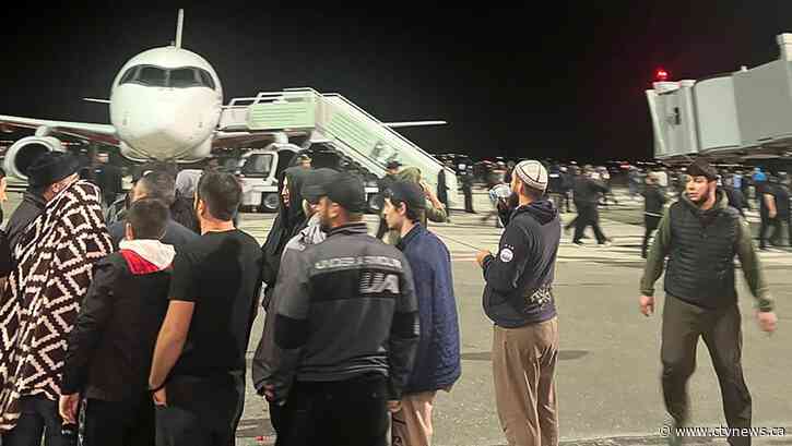 Hundreds storm airport in Russia in antisemitic riot over arrival of plane from Israel