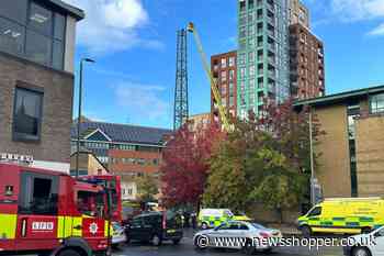 Man climbs building site crane in St Marks Road Bromley