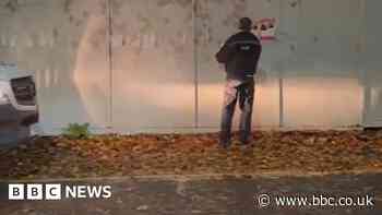 Inquiry after officer seen removing posters of kidnapped Israelis