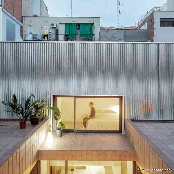 CRÜ transforms public laundry into La Clara house in Barcelona