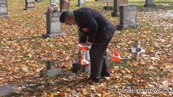 Symbols of remembrance grace veteran's graves in Victoria Harbour