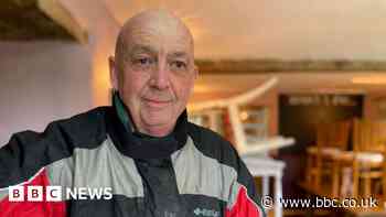 Emotional landlord assesses flood damage to pub