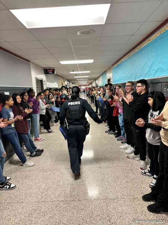 Students, staff send SRO officer off with parade