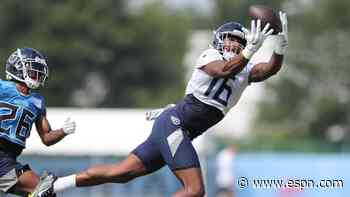 Titans' Burks carted off after awkward landing
