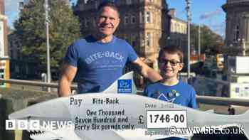 Lincolnshire boy presents charity cheque to TV adventurer