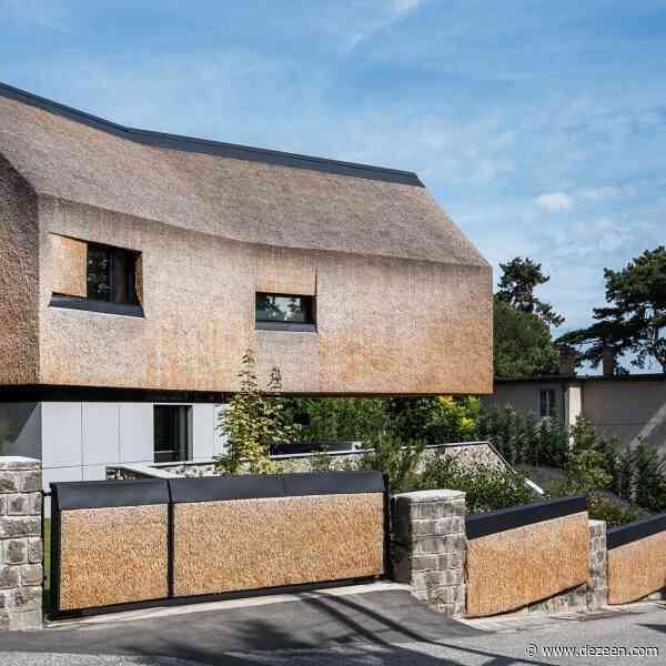 RAPA combines thatch and stone at lakeside holiday home
