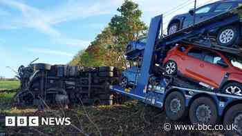Loaded car transporter leaves M4 and overturns near Bath