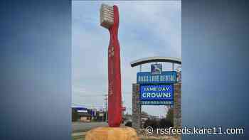 Artist carves giant toothbrush for New Hope dental clinic