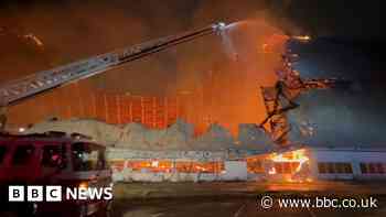 California WW2-era blimp hanger engulfed in flames