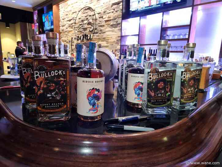 Indiana University basketball alumni and former NBA player Alan Henderson hosts bottle signing event