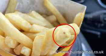 Real life happy meal! McDonald's fan spots 'smiling chip' peeping back at him