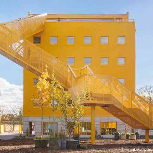 MVRDV completes yellow office retrofit with zigzagging outdoor staircase