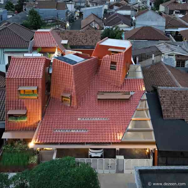 Angular clay-tile roof crowns Jakarta home by Ismail Solehudin Architecture