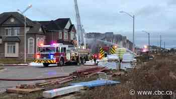 Crews battle fire at new housing development in Burlington deemed suspicious by police
