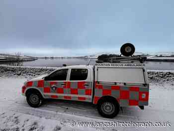 Mountain rescue team save injured person after fall