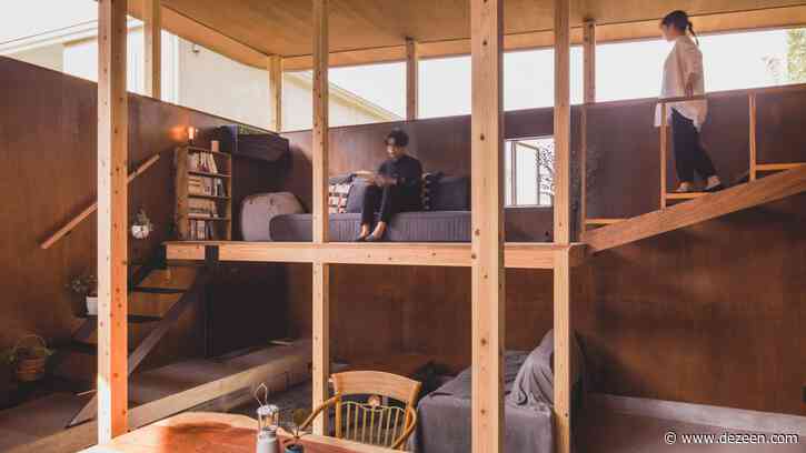 Narrow timber columns frame interiors of home in Japan by IGArchitects